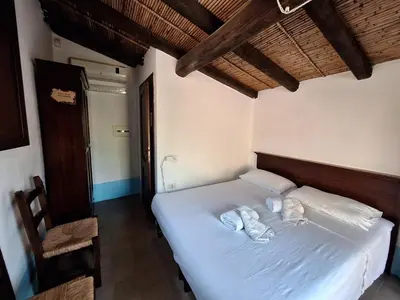 Letto o letti in una camera di Malicas