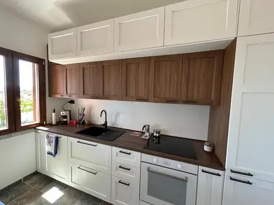 Cucina o angolo cottura di Villa con giardino e spettacolare vista mare a Porto San Paolo
