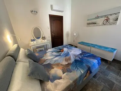 Letto o letti in una camera di Villa con giardino e spettacolare vista mare a Porto San Paolo
