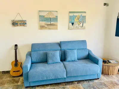 Area soggiorno di Villa con giardino e spettacolare vista mare a Porto San Paolo