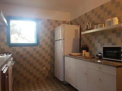 Cucina o angolo cottura di Beachfront villa, right ON SAND!