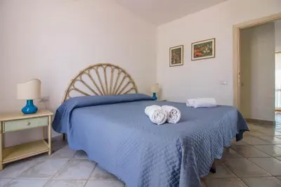 Letto o letti in una camera di GuestHost - Seaview Villa with Veranda GolfoAranci