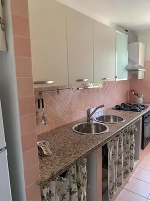 Cucina o angolo cottura di Splendido appartamento San Teodoro centro