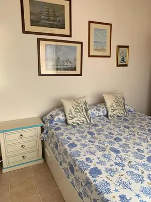 Letto o letti in una camera di Splendido appartamento San Teodoro centro