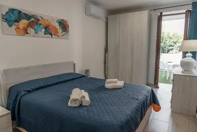 Letto o letti in una camera di Casa dei nonni