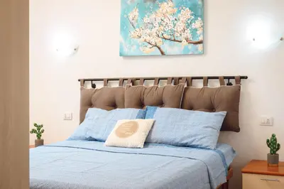 Letto o letti in una camera di VILLETTA ESCLUSIVA CON GIARDINO, San Teodoro Paradiso Terrestre