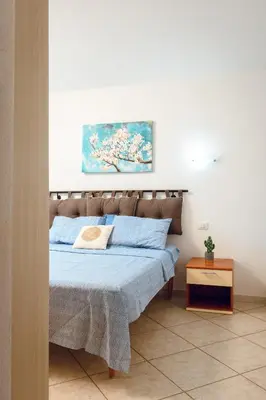 Letto o letti in una camera di VILLETTA ESCLUSIVA CON GIARDINO, San Teodoro Paradiso Terrestre