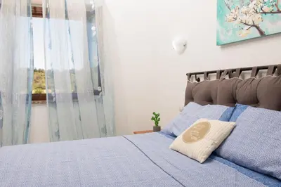 Letto o letti in una camera di VILLETTA ESCLUSIVA CON GIARDINO, San Teodoro Paradiso Terrestre