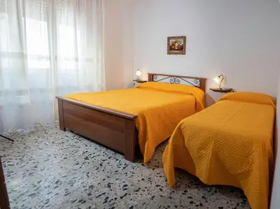 Letto o letti in una camera di Casa Maria