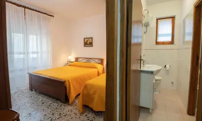 Letto o letti in una camera di Casa Maria