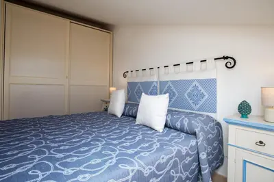Letto o letti in una camera di Appartamento la Via del Mare by Wonderful Italy