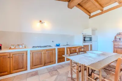 Cucina o angolo cottura di Splendido Stazzo vista mare San Teodoro Lu Fraili