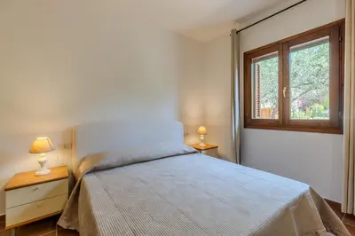 Letto o letti in una camera di Splendido appartamento vista mare San Teodoro