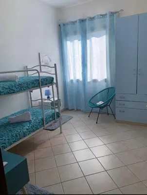 Letto o letti in una camera di Orchidea