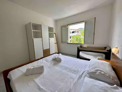 Letto o letti in una camera di Corallo Spacious place to stay steps from the sea