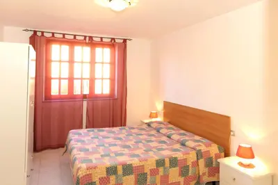 Letto o letti in una camera di Casa Su Lizzu