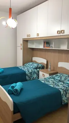 Letto o letti in una camera di Casa Marianna Cala Gonone mare