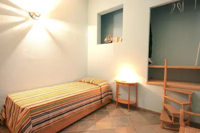Letto o letti in una camera di Smeraldo - Lovely apartment for vacation