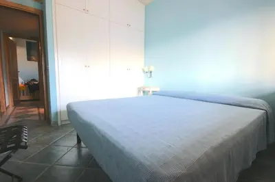 Letto o letti in una camera di Smeraldo - Lovely apartment for vacation
