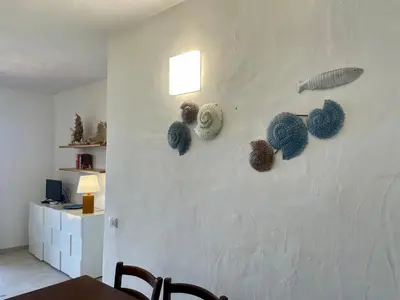 TV o dispositivi per l'intrattenimento presso Villaggio Est 2 camere con Giardino Vista Mare