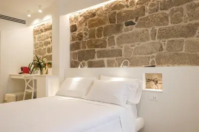 Letto o letti in una camera di Emma's Downtown - Eco Design Rooms