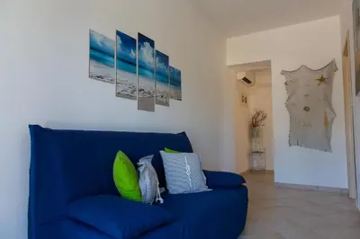 Area soggiorno di La Pavoncella Marina - Cozy home near Porto Taverna