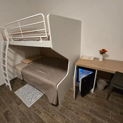 Letto o letti in una camera di Miluna Affittacamere