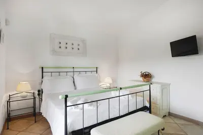Letto o letti in una camera di Casa Elena al mare con piscina