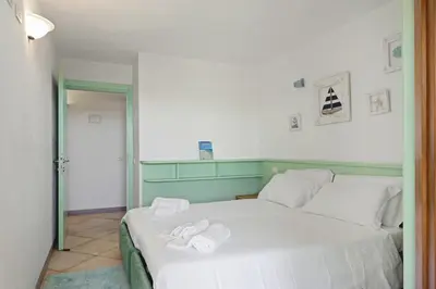 Letto o letti in una camera di Casa Elena al mare con piscina