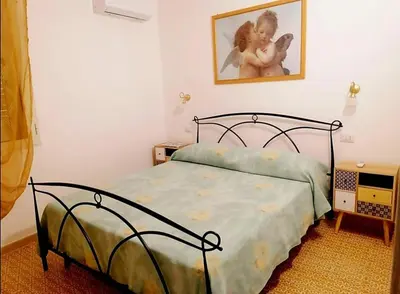 Letto o letti in una camera di Casa Aurora
