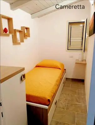 Letto o letti in una camera di Casa Aurora