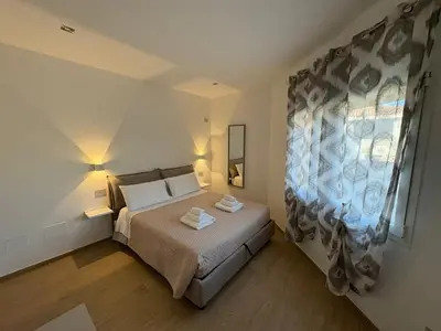 Letto o letti in una camera di La Casetta di Seby - Appartamento moderno a Olbia