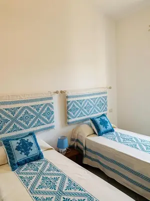 Letto o letti in una camera di La Pavoncella