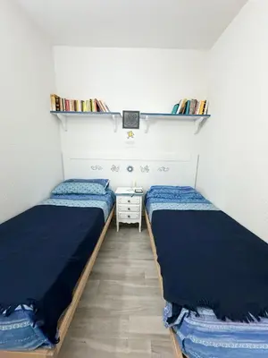Letto o letti in una camera di Casa vacanza Gramsci - 900mt dalla spiaggia