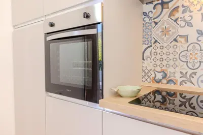 Cucina o angolo cottura di Delizioso Appartamento San Teodoro Lu Fraili