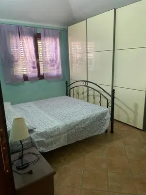 Letto o letti in una camera di Veranda sul mare , i Pini