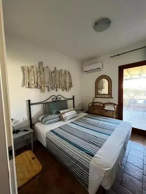 Letto o letti in una camera di Relax in Olbia Apartment with Private Garden 2 Bedrooms
