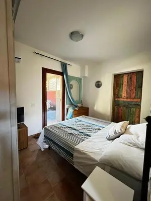 Letto o letti in una camera di Relax in Olbia Apartment with Private Garden 2 Bedrooms