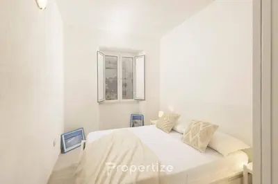 Letto o letti in una camera di Lumìa - by Propertize