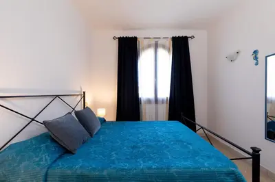 Letto o letti in una camera di Casa di Barbara al Mare by Wonderful Italy
