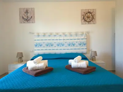 Letto o letti in una camera di Villetta Lucy - Budoni Sweet Home