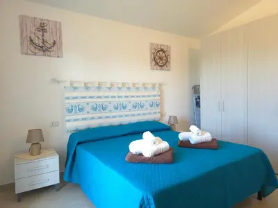 Letto o letti in una camera di Villetta Lucy - Budoni Sweet Home