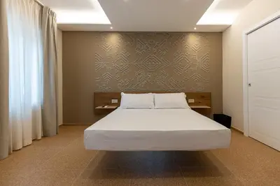 Letto o letti in una camera di MIRARI Design Rooms