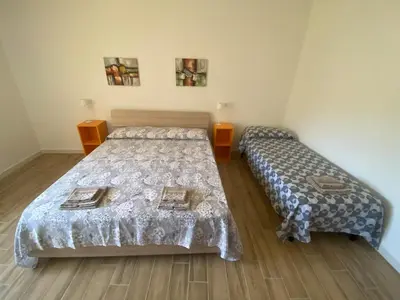 Letto o letti in una camera di Galtellì casa vacanze