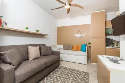 Area soggiorno di Il Vecchio Faro 19 - Happy Rentals