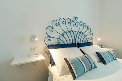 Letto o letti in una camera di Rita's House