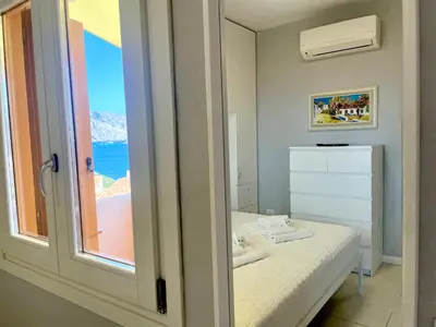 Letto o letti in una camera di Monolocale Terrazza Vista Mare
