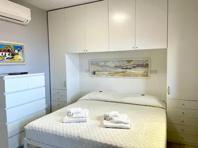 Letto o letti in una camera di Monolocale Terrazza Vista Mare