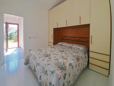 Letto o letti in una camera di La Casa di Marco Villaggio Liscia Eldi San Teodoro