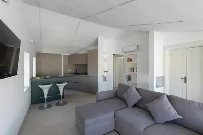 Area soggiorno di Romantic Apartment with Terrace by Wonderful Italy